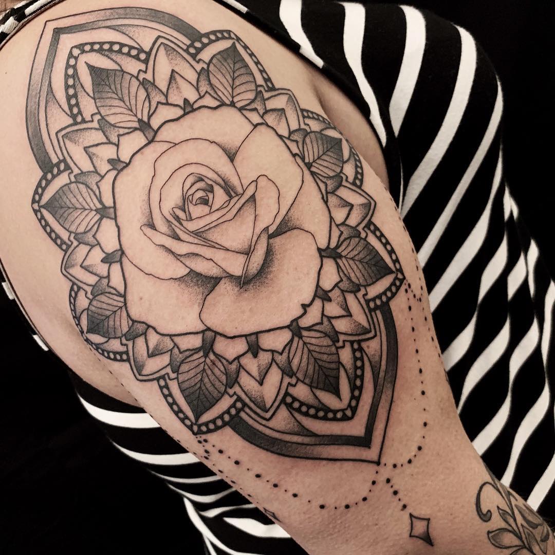Upper Arm Tattoo in Black and Grey of a Rose Surrounded by a Mandala done by Tattoo Artist Alan Lott at Sacred Mandala Studio in Durham, NC.